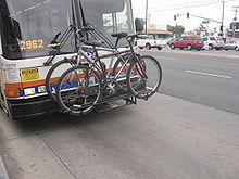 Front-mounted bike rack on public transit bus in USA - pic by Buchanan-Hermit, Wikimedia Commons, CC-BY-2.0