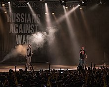 Russian rapper Oxxxymiron announced a series of benefit concerts outside Russia, entitled Russians Against War, the proceeds from which would be donated to NGOs helping Ukrainian refugees. Oxxxymiron RAW Berlin asv2022-04 img10.jpg