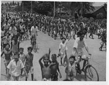 Japanese prisoners of war being marched through the streets of George Town by their British captors on 3 September 1945. Reoccupation of Penang (5315445771).jpg