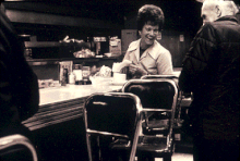 A woman working as wait staff at a diner, United States, 1981 Waitress diner pike place seattle.gif
