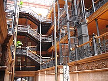 Cast iron balustrades of the type sometimes called "filigree", in the central atrium of the Bradbury Building in Los Angeles Bradbury Building, interior, ironwork.jpg