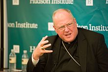 Dolan speaking at a conference His Eminence, Cardinal Timothy Dolan, The Islamic State's Religious Cleansing and the Urgency of a Strategic Response.jpg
