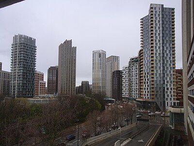 The emerging cluster in Lewisham also known as Lewisham Gateway, and first Borough of Sanctuary,[501] which includes 209 Connington Road Tower at 117m tall which is the white building in the centre and Lewisham Exchange at 105m tall to the left of it. All of the high-rises shown in this picture are residential with the exception of the grey building shown in the immediate right foreground which was formerly the London offices of Citigroup until they relocated to 25 Canada Square at Canary Wharf in 2001