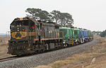 A Pacific National cement train led by Victorian X class locomotive X31 at Grovedale, Victoria, Australia, in 2007