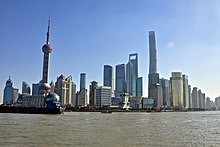 Shanghai has become a symbol of the recent economic boom of China. Shanghai Skyline, Dec2014.jpg
