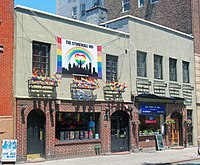 Stonewall Inn 2012 with gay-pride flags and banner.jpg