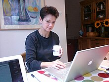 Diane Coyle at work with Apple laptop-9Oct2009.jpg