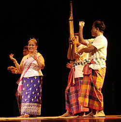 A khene player and Lao dancers at a morlam performance in France.