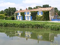 Traditional house by a canal.