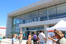 Exterior of National Synchrotron Light Source II facility in 2012, during a Brookhaven National Laboratory "Summer Sundays" public tour. National Synchrotron Light Source II.jpg