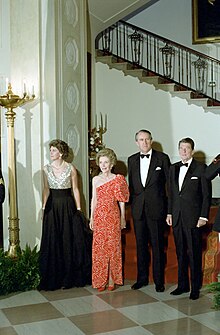 Prime Minister Malcolm Fraser (second right) and Tamie Fraser (left) with US President Ronald Reagan and Nancy at the White House in 1982. Fraser came to power amidst the divisive 1975 Australian constitutional crisis, but went on to lead Australia into the 1980s. President Ronald Reagan and Nancy Reagan with Prime Minister Malcolm Fraser and Tamara Fraser.jpg
