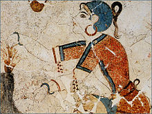 A fresco depicting an elegantly dressed woman with hoop earrings from Akrotiri, Thera (Cyclades) Greece, c. 1650-1625 BCE. Santorini girl picks flowers.jpg