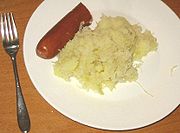 Sauerkraut and sausage served on a plate