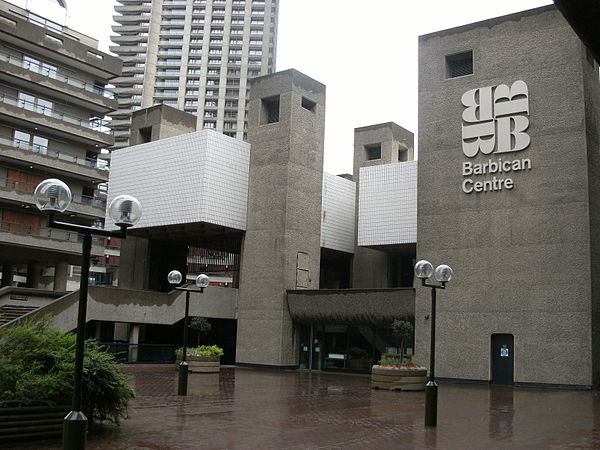 Photograph of cuboid, grey, concrete buildings.