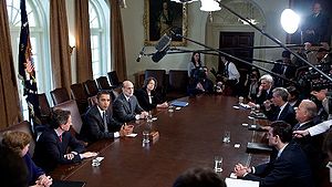 President Barack Obama, left, flanked by Treas...