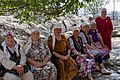 Kyrgyz women rest while on visit to sacred mountain