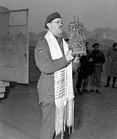 Captain Samuel Cass, a rabbi, conducting the first prayer service celebrated on German territory by Jewish personnel of the First Canadian Army near Cleve, Germany, 18 March 1945 Jewish Canadian soldiers during WWII.jpg