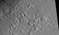 Surface features of Lycus Sulci, as seen by HiRISE under the HiWish program.