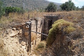 Ruins of the wall of the dromos and doorway of the Prosymna Tholos