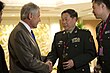 Secretary of Defense Chuck Hagel speaks with Chinese Lieutenant General Qi Jianguo.jpg