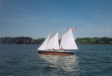 Close-hauled: the pennant is streaming backwards, the sails are sheeted in tightly.