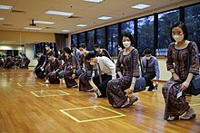 Singapore Airlines' flight attendant trainees attend a deportment class, learning how to pick up objects when in uniform.