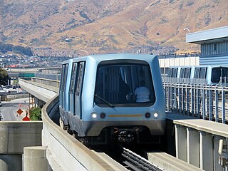 A people mover train on an elevated guideway