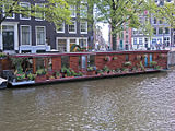 This is a houseboat, moored Category:Houseboats