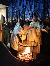 American Benedictine monks around an Easter fire preparing to light the Paschal candle prior to Easter Vigil mass BenedictineEasterVigil.jpg