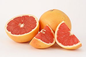 This photograph shows two pink grapefruits (Ci...