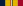 A multicolored military ribbon. From left to right the color pattern is; very thick blue stripe, very thick yellow stripe, thin red stripe, thick white stripe, thin blue stripe, very thick yellow stripe, very thick red stripe