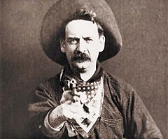 Justus D. Barnes in Western apparel, as "Bronco Billy Anderson", from the silent film The Great Train Robbery (1903), the second Western film and the first one shot in the United States Great train robbery still.jpg