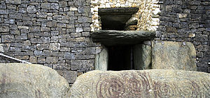 English: This is the entrance to the Megalithic Passage Tomb at Newgrange in Boyne Valley, Ireland. The top entrance, or 'roof box' entrance, is for the sun.