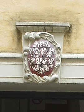 The cartouche above the door of the rear wing.