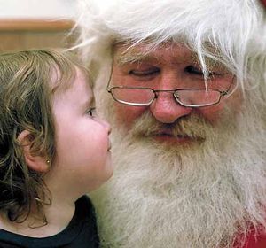 English: Santa Claus with a little girl Espera...