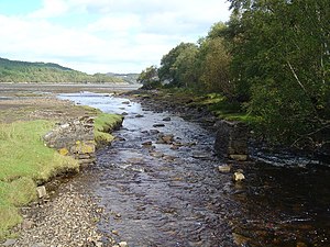 South of Kentra Bay View from a river crossing (of Allt Eas an Taileir?) showing the piers of a previous bridge and the ford beyond. The view opens out to the mudflats of Kentra Bay in the distance.