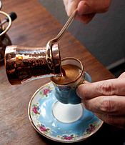 A cup of Turkish coffee, served from a copper cezve, in Turkey