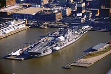 An aerial view of the USS Intrepid docked at pier 86.