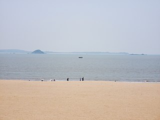 View of Binlang Islet from Xiamen's One country, two systems beach (center left)