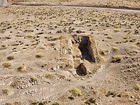 November 4, 2022. A trench from past excavations. The trench is surrounded by numerous looters' pits