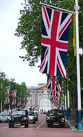 Union Flag being flown on The Mall, London looking towards Buckingham Palace A typical london street.jpg