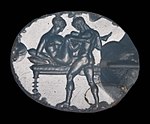 Engraving of an erotic scene on an ancient Greek gem. Late 5th to early 4th century BCE Ancient Greek Oval gem with an erotic scene.jpg