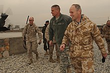 British desert version of DPM worn by a British Army officer, right. Brigadier Simon Levey walks with U.S. Army Lt. Gen. David M. Rodriguez at the Kabul Military Training Center (4305720633).jpg