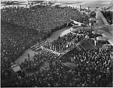 1000th B-29 delivery ceremony at Boeing Wichita plant in February 1945 Favored by Warm breezes and under a blue Kansas Sky, a vast crowd attends the delivery ceremony on the Boeing-Wichita... - NARA - 196890.jpg