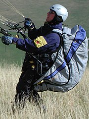 Pilot with harness (light blue) doing reverse launch