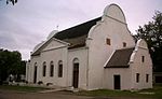 The Mission Station was founded in 1808 by Moravian missionaries on the site occupied by the Dutch East India Company's military outpost, "'t Groenekloof", from 1701 to 1791. The old farm house (now the parsonage) was certainly built before 1770, and the original gable of the church building bears the date 1818, although later it was slightly altered. Type of site: Mission Station. The Mission Station which is an important place of interest because of both its history and its architectural beauty, was founded in 1808 by Moravian missionaries on the site occupied by the Dutch East India Company's military outpost, "'t Groenekloof".