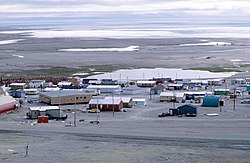 Resolute in 1997. Visible on the left is a long school building (brown).