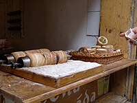 Trdelník on the metal pin upon which they are baked