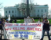Anti-war protest in Washington, D.C., 20 March 2010 2010-03-20 13-16-37stpetestopthemilitarismfundhumanneedsnotwar.JPG