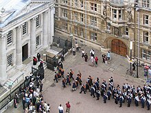 Graduands enter Senate House at a graduation ceremony. Cambridge University graduation enter Senate House.jpg